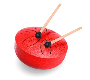 Image of Red toy tongue drum in air on white background. Child's musical instrument