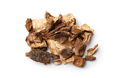 Photo of Pile of dry chicory roots isolated on white, top view