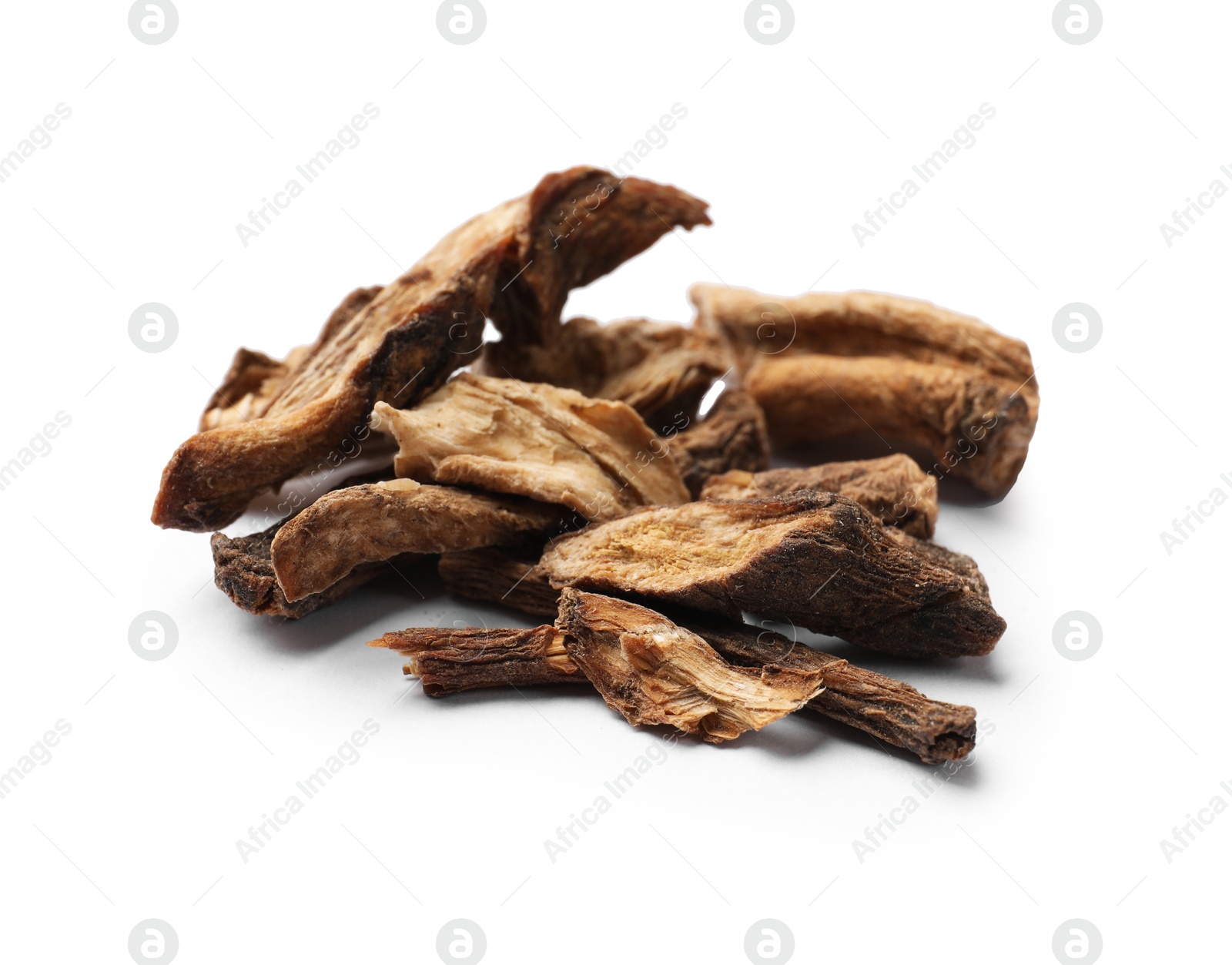 Pile of dry chicory roots isolated on white Photo of Pile of dry chicory roots isolated on white