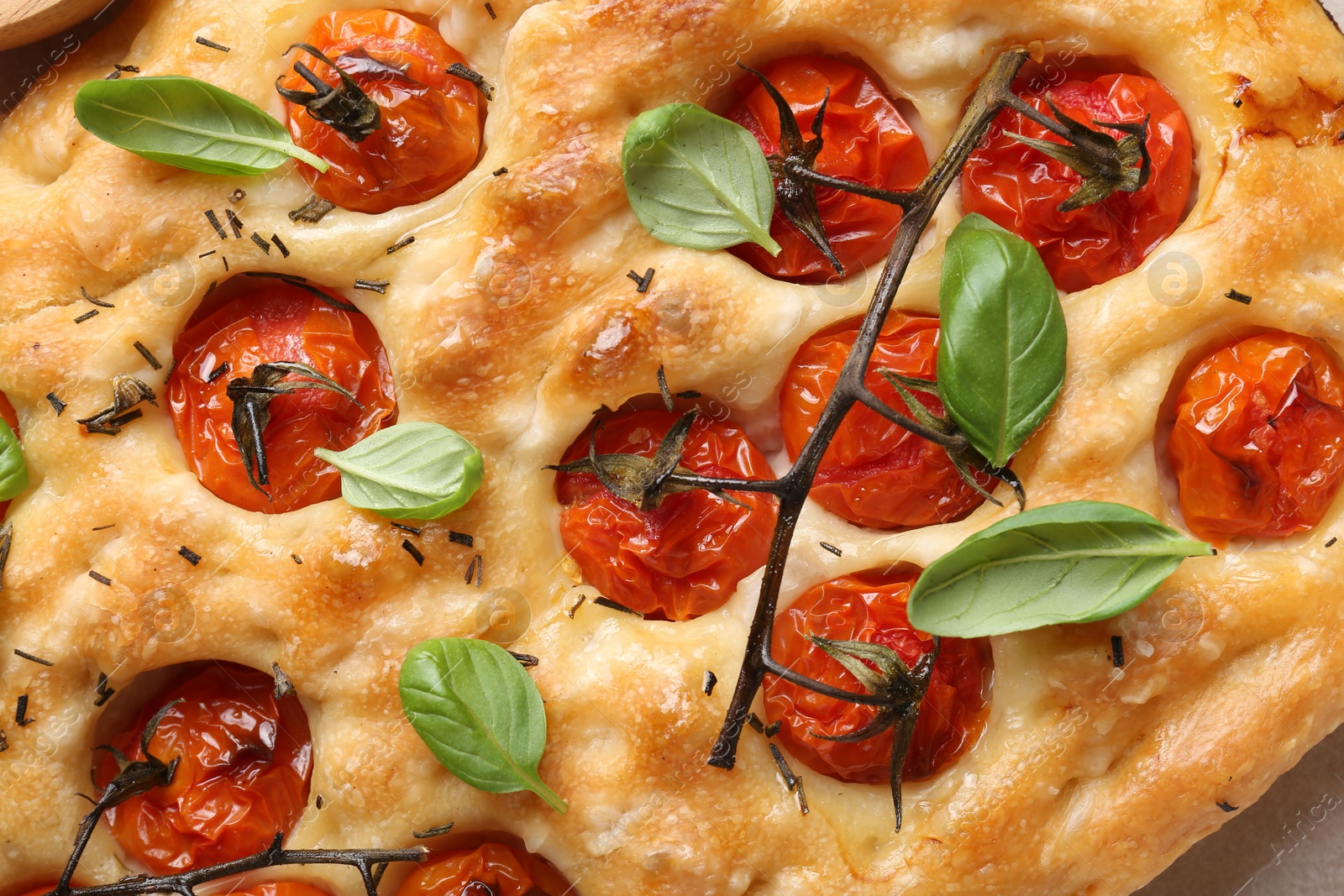 Delicious focaccia with tomatoes and spices as background, top view Photo of Delicious focaccia with tomatoes and spices as background, top view