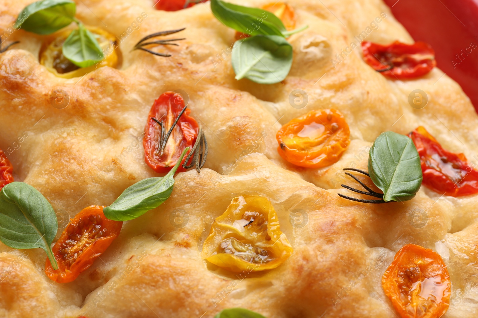 Delicious focaccia with tomatoes and spices as background, closeup Photo of Delicious focaccia with tomatoes and spices as background, closeup
