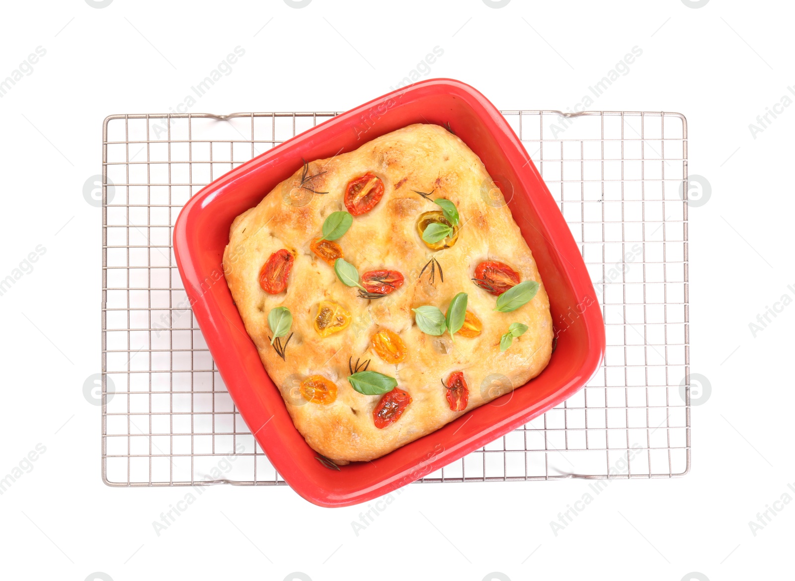 Delicious focaccia with tomatoes and spices in baking dish isolated on white, top view Photo of Delicious focaccia with tomatoes and spices in baking dish isolated on white, top view