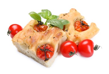 Photo of Pieces of delicious focaccia with tomatoes and spices isolated on white
