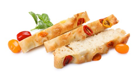 Photo of Pieces of delicious focaccia with tomatoes and basil isolated on white