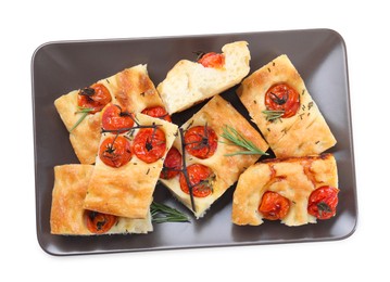 Photo of Pieces of delicious focaccia with tomatoes and spices isolated on white, top view