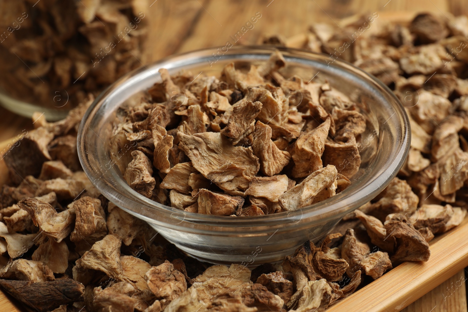 Pieces of dry chicory roots in bowl on table, closeup Photo of Pieces of dry chicory roots in bowl on table, closeup