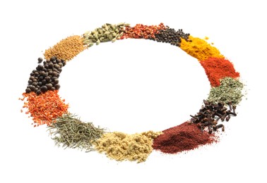 Photo of Piles of many different spices isolated on white