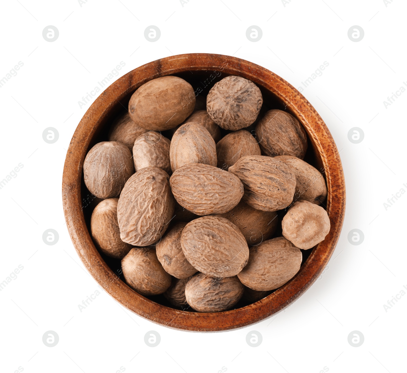 Nutmegs in bowl isolated on white, top view Photo of Nutmegs in bowl isolated on white, top view