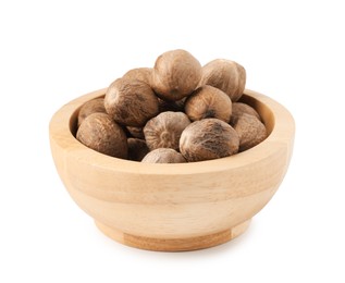 Photo of Fresh nutmegs in bowl isolated on white
