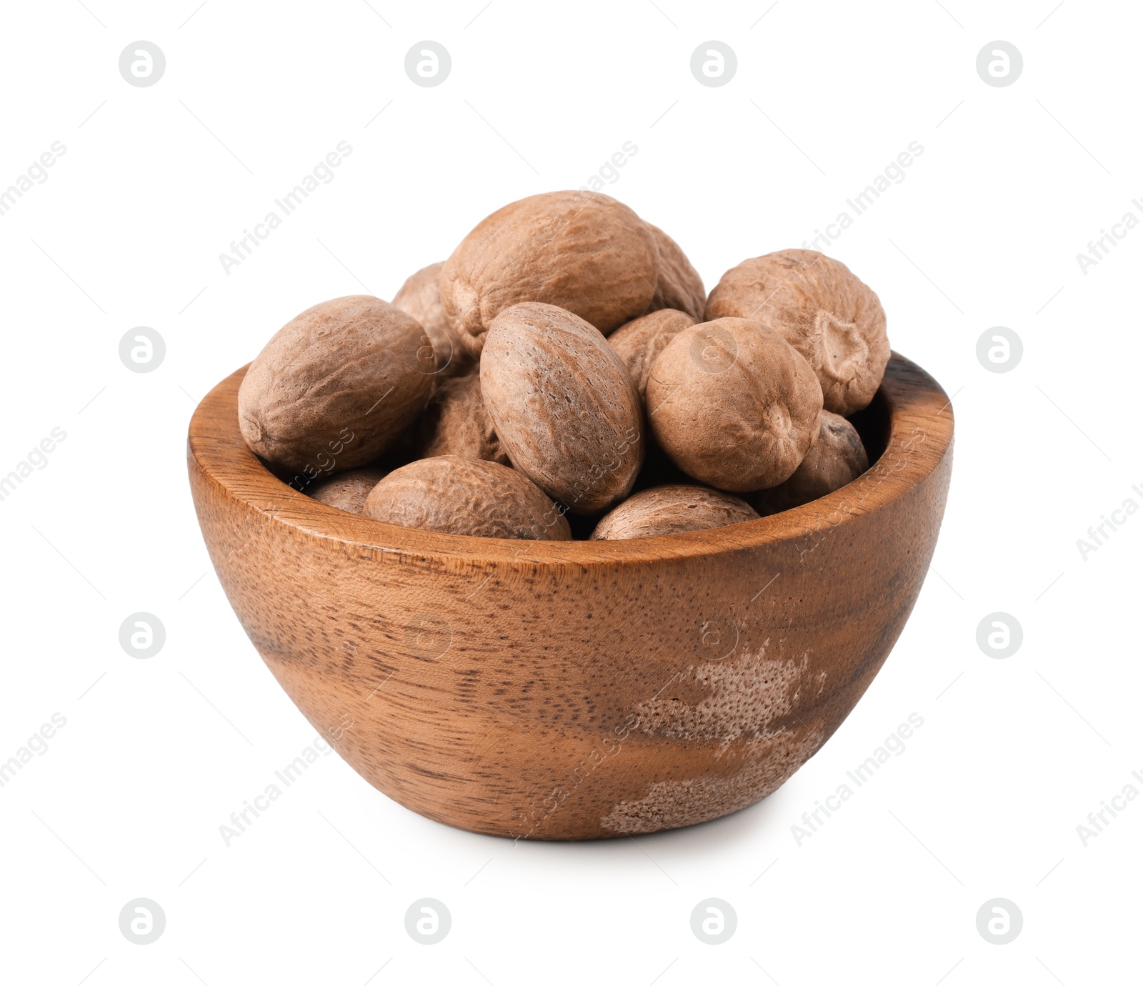 Fresh nutmegs in bowl isolated on white Photo of Fresh nutmegs in bowl isolated on white