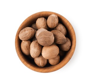 Photo of Nutmegs in bowl isolated on white, top view
