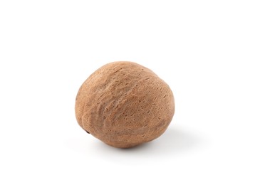 Photo of One whole fresh nutmeg isolated on white