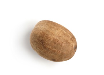 Photo of One whole fresh nutmeg isolated on white, top view