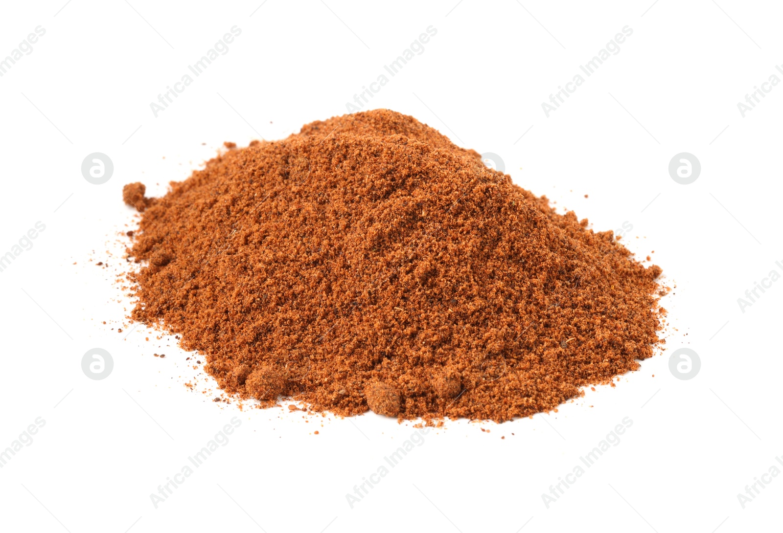 Pile of nutmeg powder isolated on white Photo of Pile of nutmeg powder isolated on white
