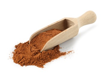 Photo of Nutmeg powder in scoop isolated on white