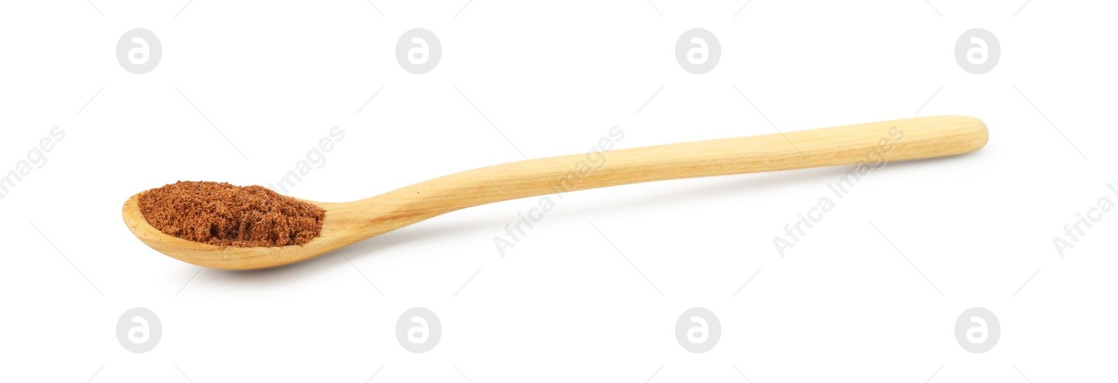 Photo of Nutmeg powder in spoon isolated on white
