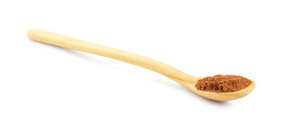 Photo of Nutmeg powder in spoon isolated on white