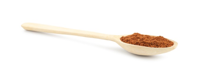 Photo of Nutmeg powder in spoon isolated on white