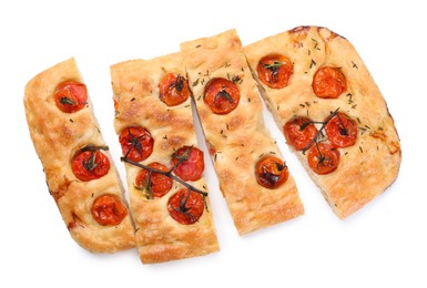 Photo of Cut delicious focaccia with tomatoes and spices isolated on white, top view