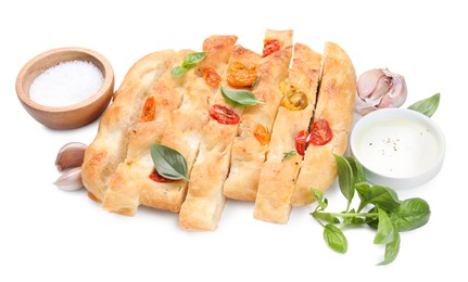 Photo of Cut delicious focaccia with tomatoes, spices and oil isolated on white