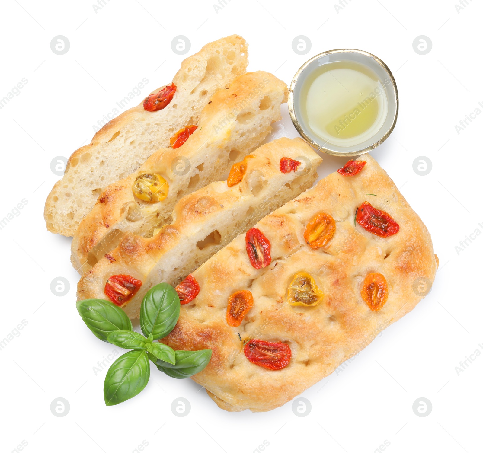 Cut delicious focaccia with tomatoes, basil and oil isolated on white, top view Photo of Cut delicious focaccia with tomatoes, basil and oil isolated on white, top view