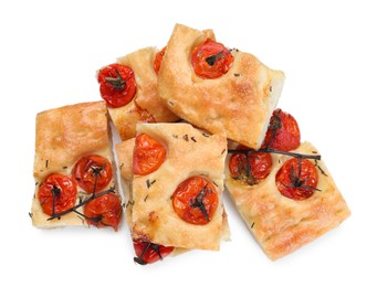 Photo of Pieces of delicious focaccia with tomatoes and spices isolated on white, top view