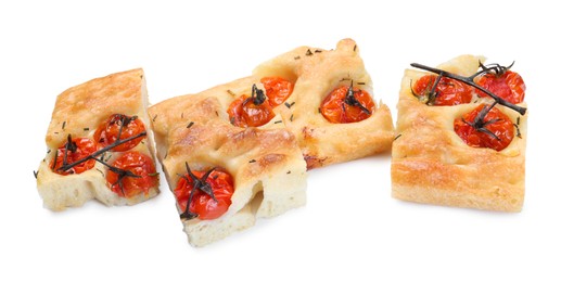 Photo of Pieces of delicious focaccia with tomatoes and spices isolated on white