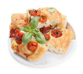 Photo of Pieces of delicious focaccia with tomatoes and spices isolated on white