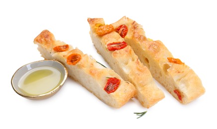 Photo of Pieces of delicious focaccia with tomatoes and oil isolated on white
