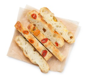 Photo of Pieces of delicious focaccia with tomatoes isolated on white, top view