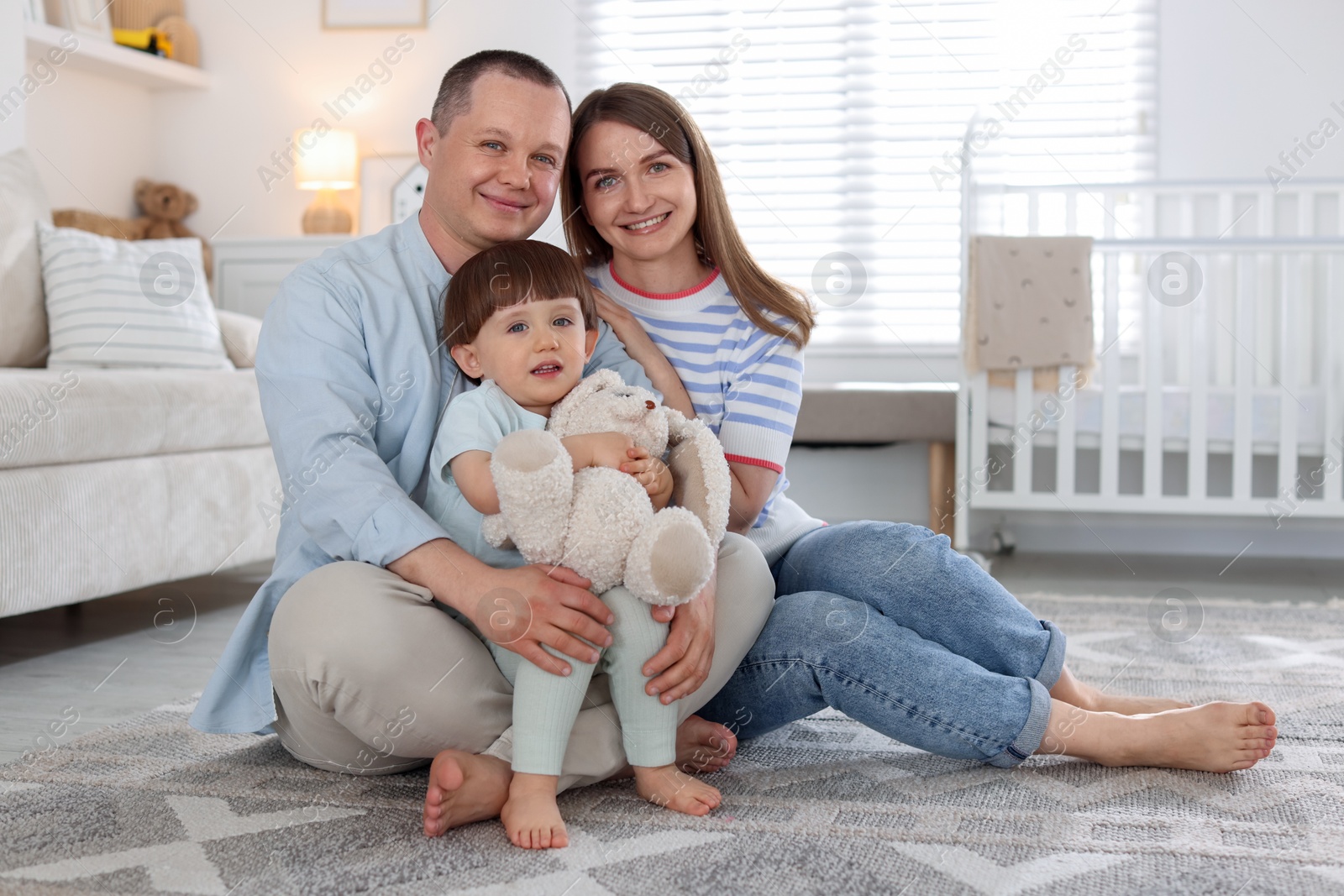 Cute little boy and his parents at home. Lovely family Photo of Cute little boy and his parents at home. Lovely family