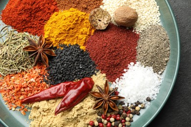 Photo of Different aromatic spices on table, top view