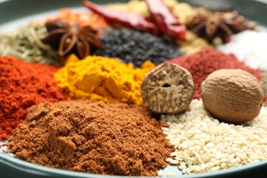 Photo of Many different aromatic spices on table, closeup