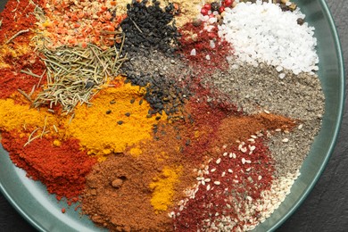Photo of Different aromatic spices on table, top view