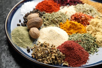 Photo of Many different aromatic spices on table, closeup