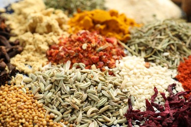 Photo of Many different aromatic spices as background, closeup