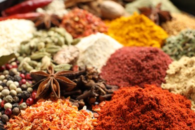 Photo of Many different aromatic spices as background, closeup