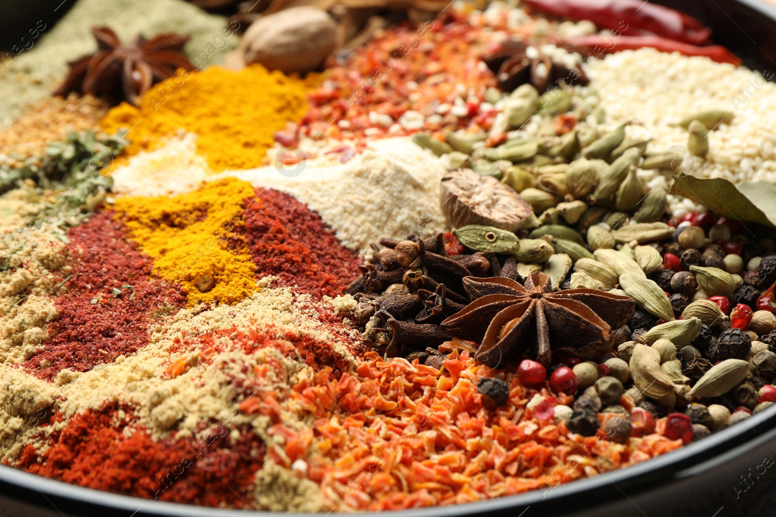Many different aromatic spices on plate, closeup Photo of Many different aromatic spices on plate, closeup