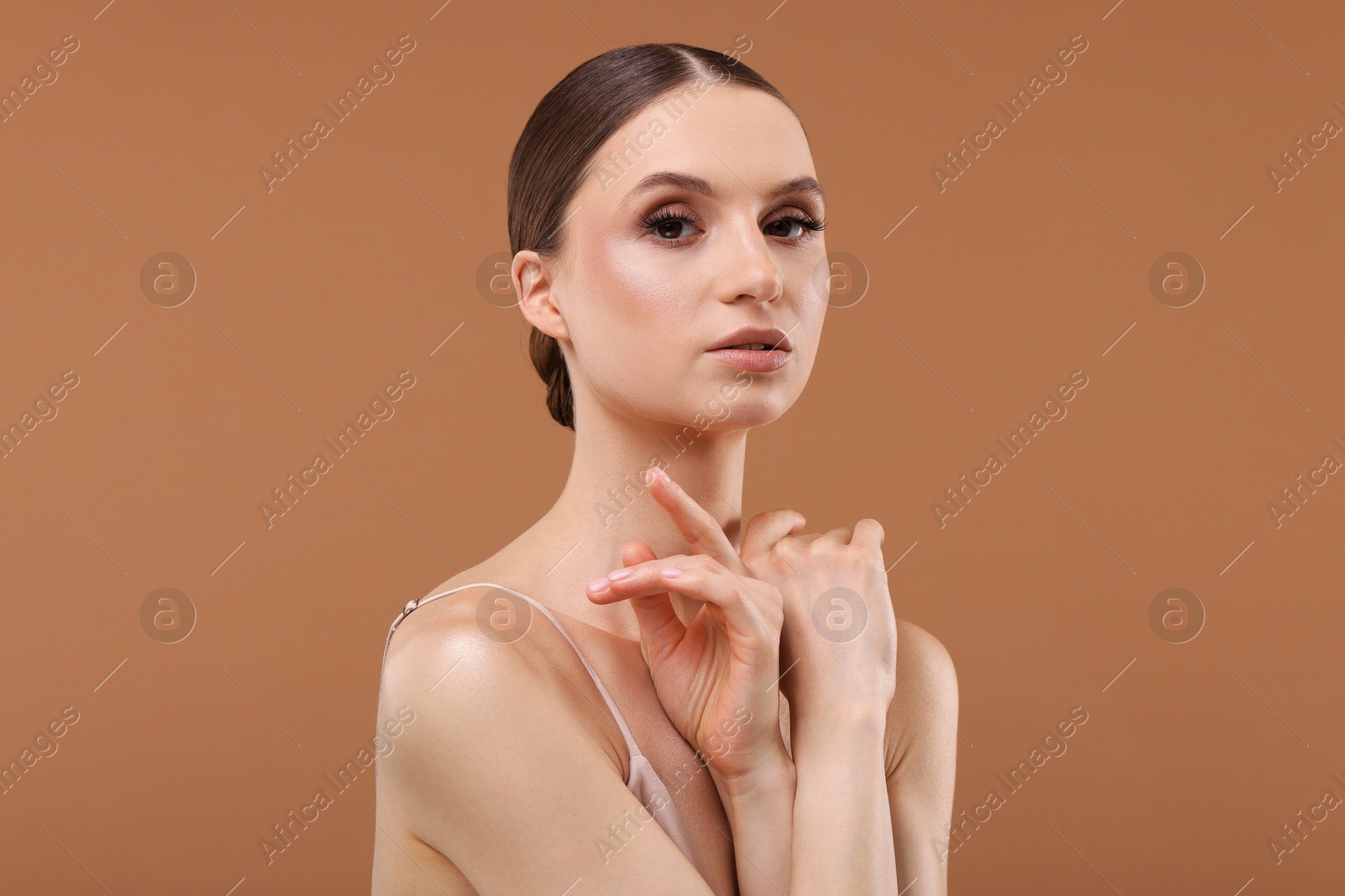 Portrait of beautiful young woman on beige background Photo of Portrait of beautiful young woman on beige background