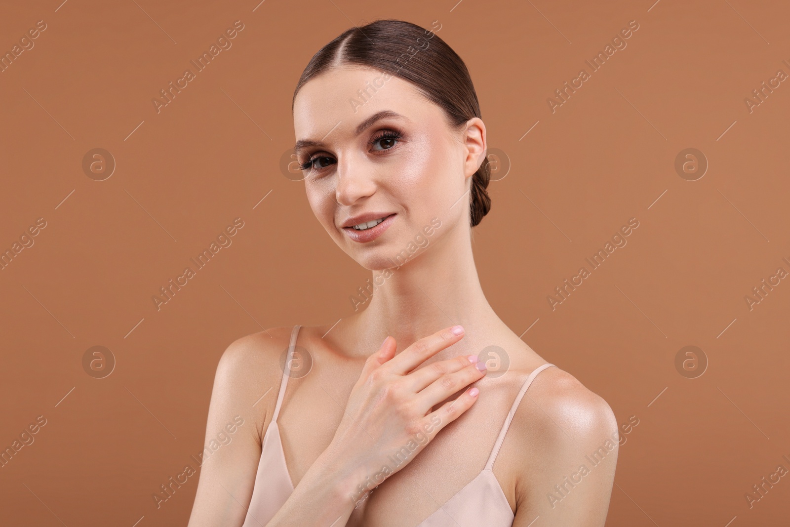 Portrait of beautiful young woman on beige background Photo of Portrait of beautiful young woman on beige background