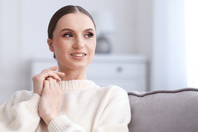 Photo of Portrait of beautiful young woman at home