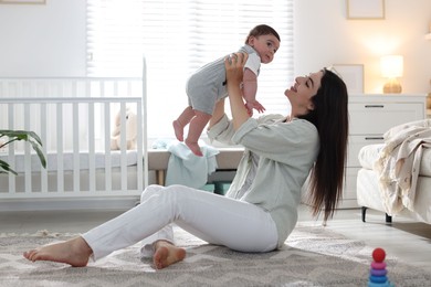 Photo of Mother with her cute baby at home. Space for text