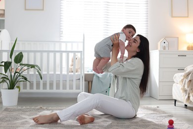 Photo of Mother with her cute baby at home. Space for text