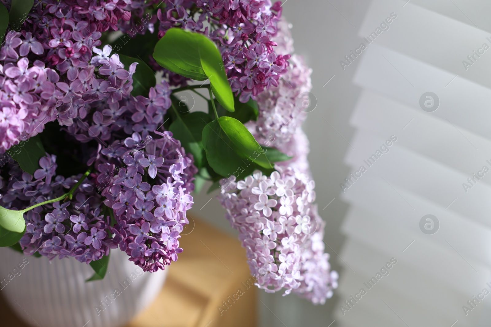 Bouquet of beautiful lilac flowers indoors, closeup Photo of Bouquet of beautiful lilac flowers indoors, closeup