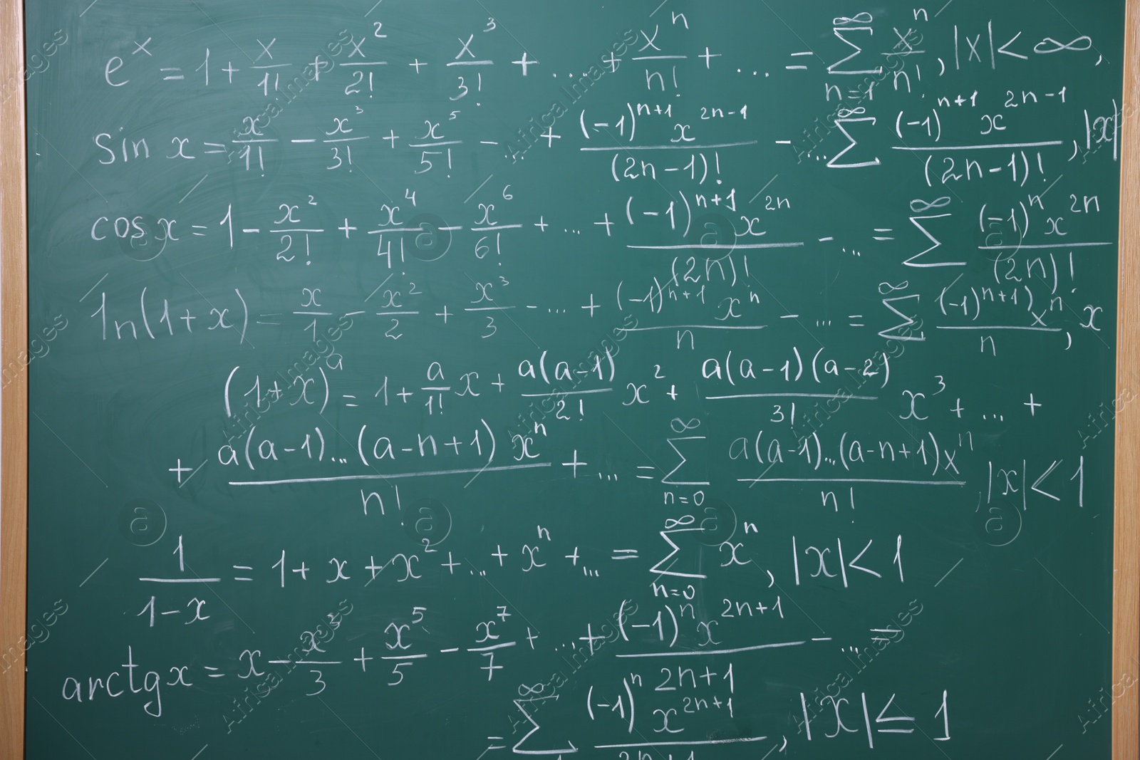 Different formulas written with chalk on blackboard Photo of Different formulas written with chalk on blackboard