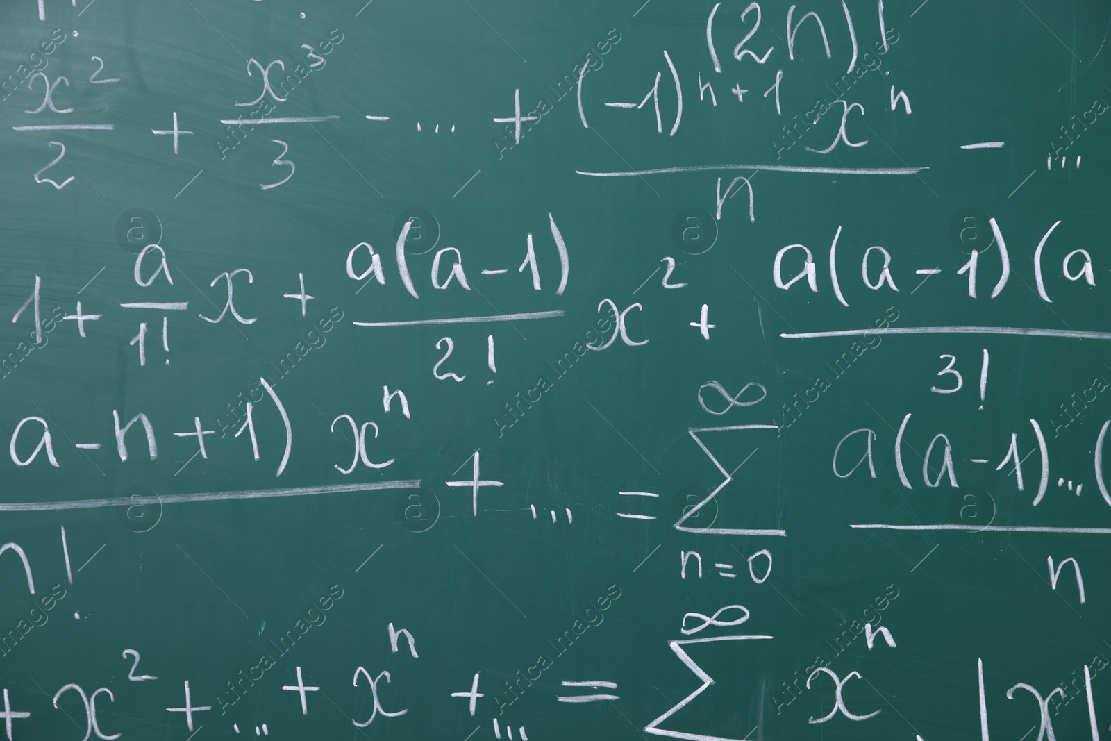 Different formulas written with chalk on blackboard Photo of Different formulas written with chalk on blackboard