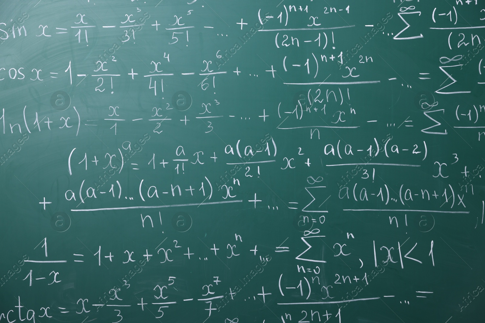 Different formulas written with chalk on blackboard Photo of Different formulas written with chalk on blackboard