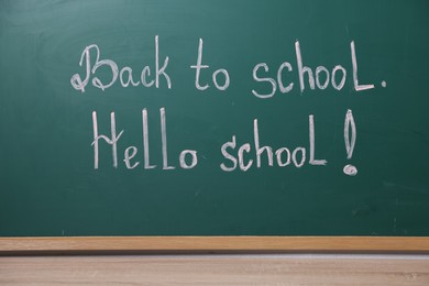 Photo of Phrases Back To School and Hello School with exclamation mark on blackboard