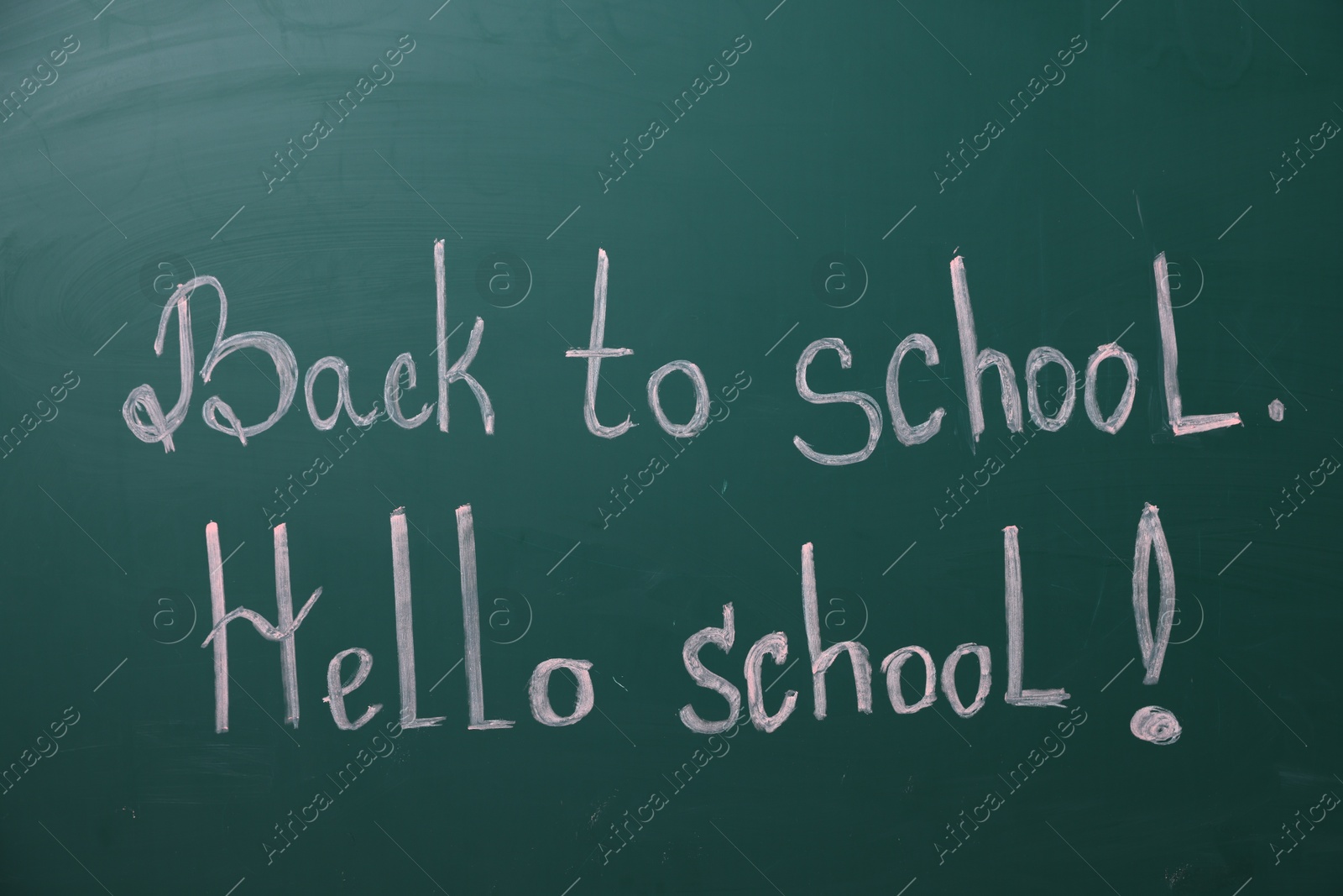 Phrases Back To School and Hello School with exclamation mark on blackboard Photo of Phrases Back To School and Hello School with exclamation mark on blackboard