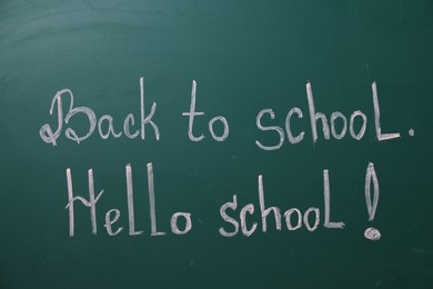 Photo of Phrases Back To School and Hello School with exclamation mark on blackboard